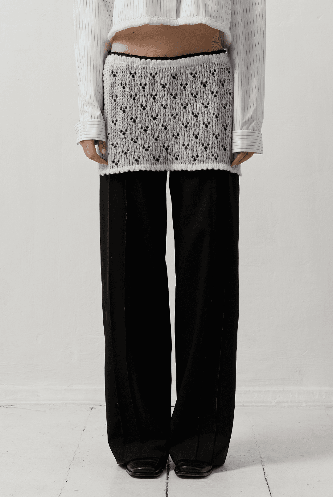 TROUSERS WITH OVERLAY